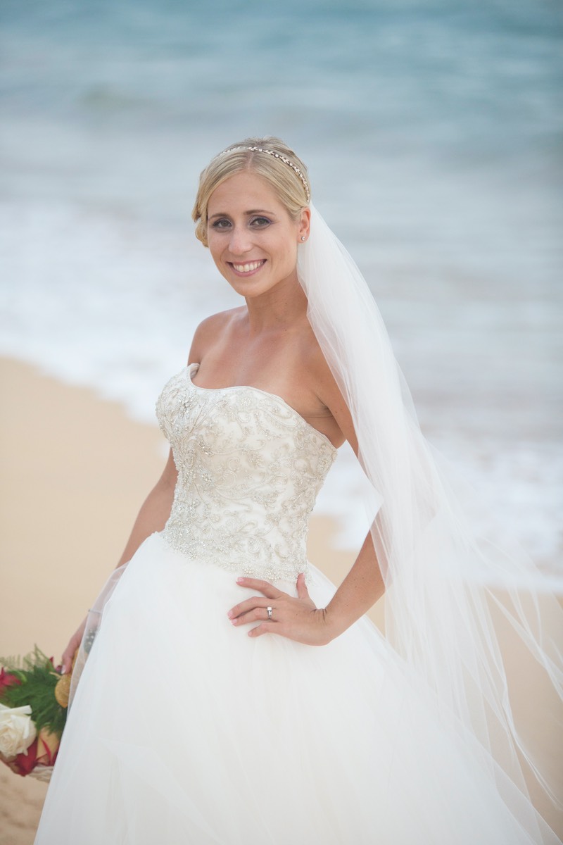 Lovely bride poses on the beach Kauai