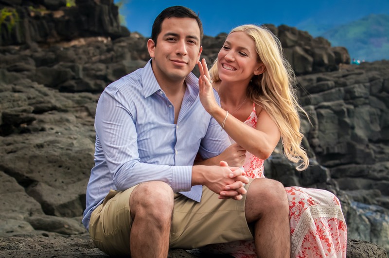 newly weds cozy up at the ocean at sunset