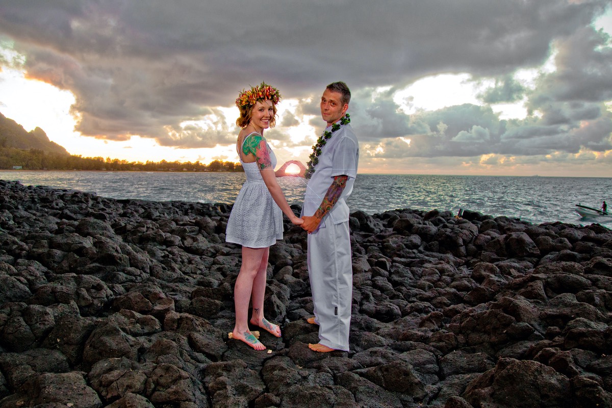 Kauai sunset in the palm of a hand or two hands. Wedding photography.